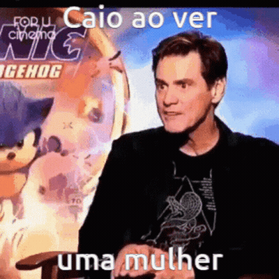 Man Talking In Front Of Sonic Poster GIF