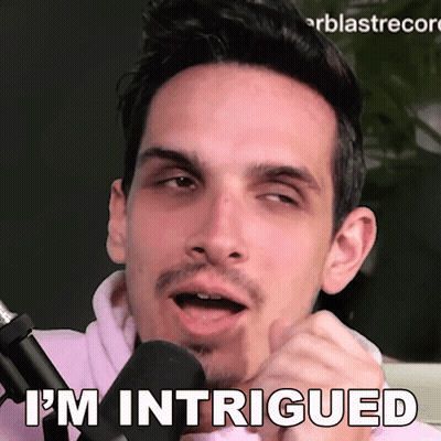 Man Talking Into Mic Saying I'm Intrigued GIF
