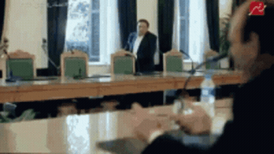 Man Talking Into Microphone, Another Behind GIF