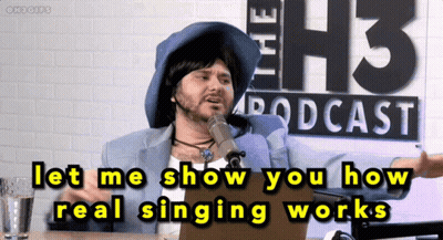 Man Talking Into Microphone At H3 Podcast Sign GIF