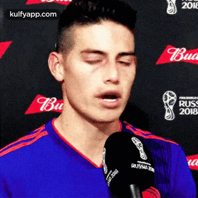 Man Talking Into Microphone Eyes Closed GIF