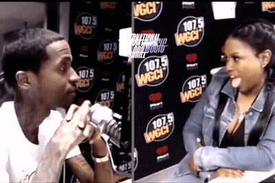 Man Talking Into Microphone In Front Of 107.5 Wall GIF
