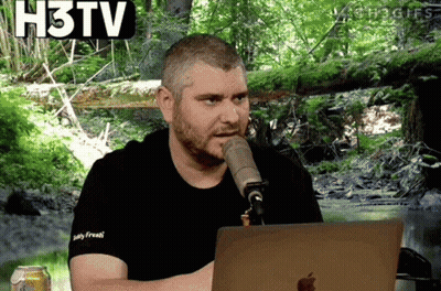 Man Talking Into Microphone In Front Of Apple Laptop GIF