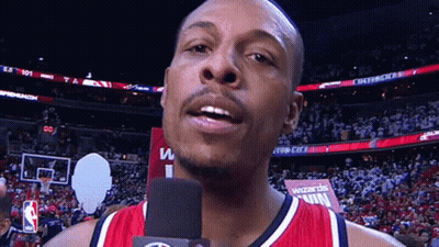 Man Talking Into Microphone In Front Of Wizards Win Sign GIF