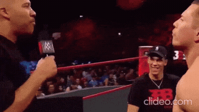 Man Talking Into Microphone In Wrestling Ring GIF