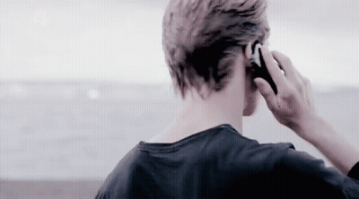 Man Talking On Cell Phone By Ocean GIF