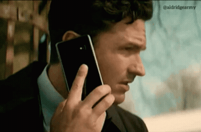 Man Talking On Cell Phone In Suit GIF