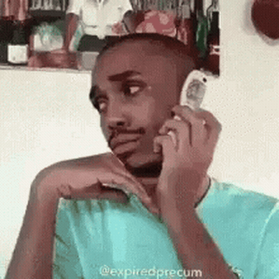 Man Talking On Cell Phone Sitting In Chair GIF