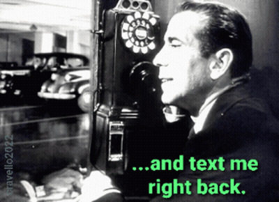 Man Talking On Pay Phone Saying Text Me Right Back GIF