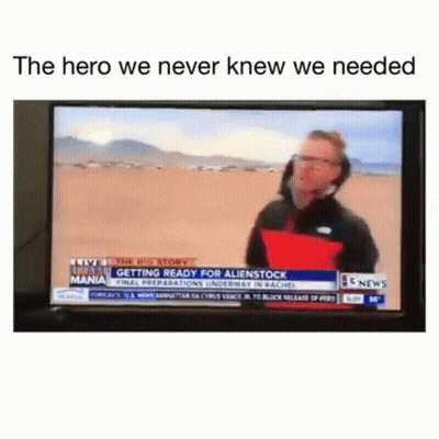 Man Talking On Television Holding Red Pillow GIF
