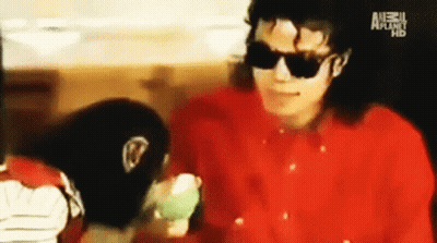 Man Talking To Monkey Wearing Red Vest 'Monkey GIF