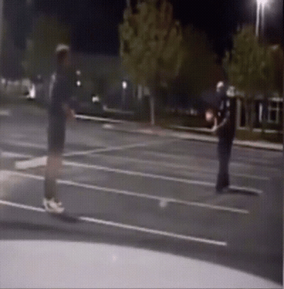 Man Talking To Police Officer In Parking Lot GIF