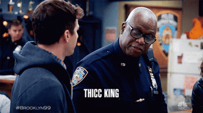 Man Talking To Police Officer With Thicc King Shirt GIF