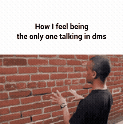 Man Talking To Someone In Front Of Brick Wall GIF