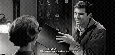 Man Talking To Woman Holding Book GIF