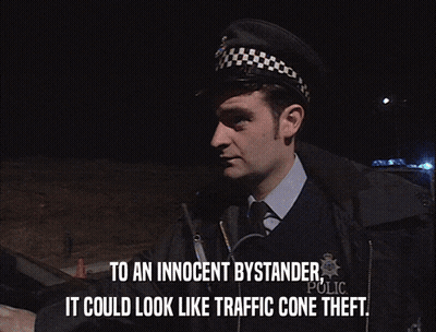 Man Telling Bystander It Could Look Like Traffic Cone Thefts GIF