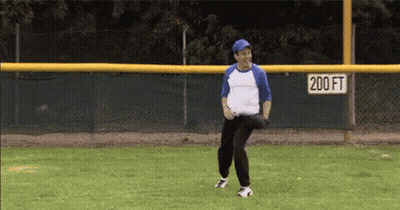 Man Throwing Baseball On Field With 200Ft Sign GIF