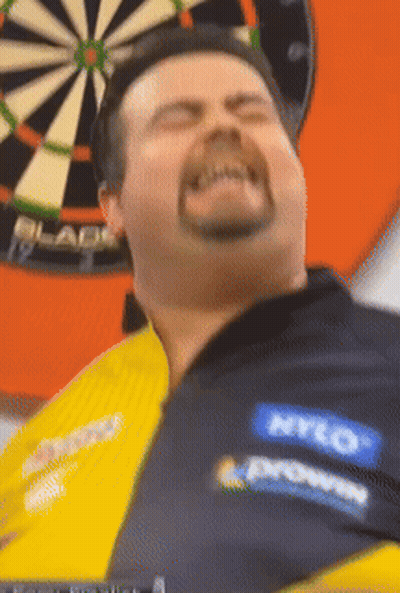 Man Throwing Dart At Unicorn Dartboard GIF