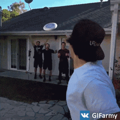 Man Throwing Frisbee In Front Of House GIF