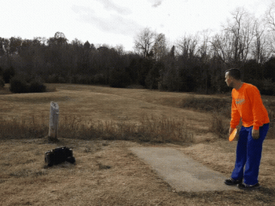 Man Throwing Frisbee In Orange Georgia Shirt GIF