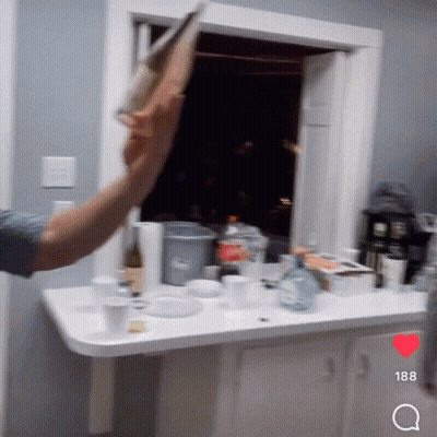 Man Throwing Paper In Kitchen With Number 188 GIF