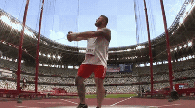 Man Throwing Shot Put In Stadium With Name Lock GIF