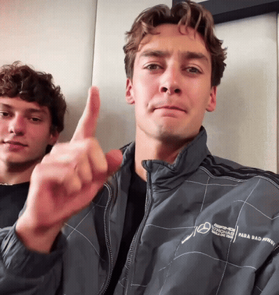 Man Thumbs Up Beside Man In AMG Jacket GIF