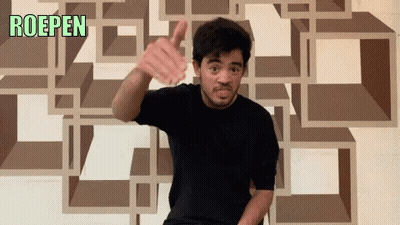 Man Thumbs Up In Front Of Roepen Wall GIF
