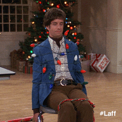 Man Tied Up With Christmas Lights GIF