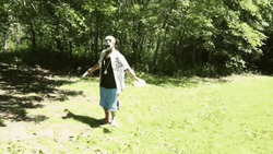 Man Tosses Frisbee GIF