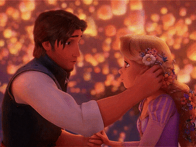 Man Touching Girl's Hair With Flower Crown GIF