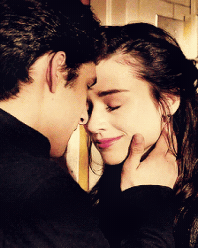 Man Touching Woman's Face GIF