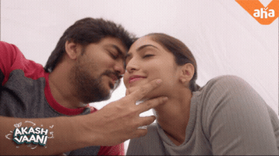 Man Touching Woman's Face With Akash Vaani Sticker GIF