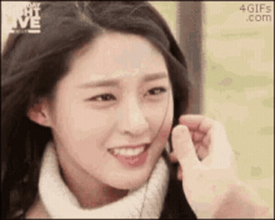 Man Touching Woman's Face With Finger GIF