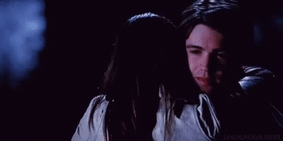 Man Touching Woman's Face With Ring GIF