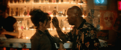 Man Touching Woman's Forehead At Bar GIF