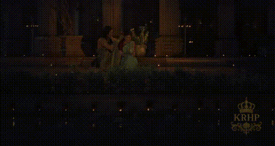 Man Touching Woman's Hair In Dark Room GIF