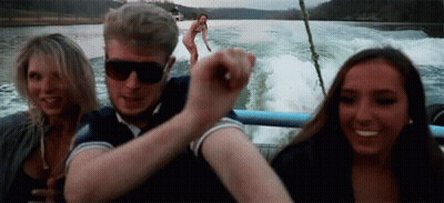 Man, Two Women On Boat, Background Woman GIF