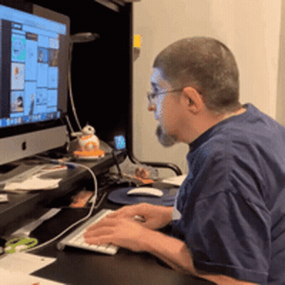 Man Typing On Keyboard In Front Of Apple Monitor GIF