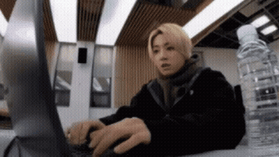 Man Typing On Laptop With Water GIF