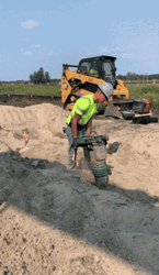 Man Using A Jackhammer On The Ground GIF