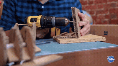 Man Using DeWalt Drill On Cardboard Box GIF