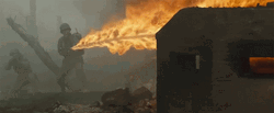 Man Using Flamethrower On Brick GIF