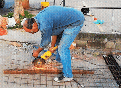 Man Using Grinder To Cut Metal GIF