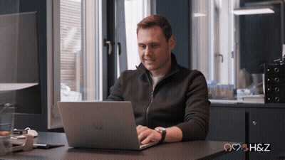 Man Using HP Laptop At Desk GIF