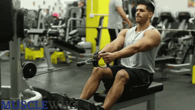 Man Using Rowing Machine In Gym With Muscleworks GIF