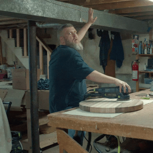 Man Using Sander On Wooden Table GIF