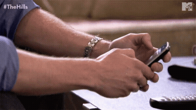 Man Using Smartphone With Hills Text GIF
