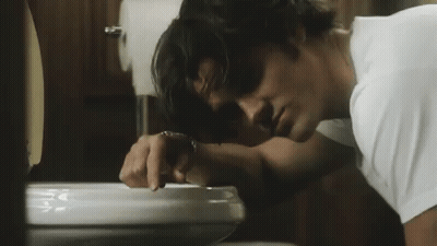 Man Vomiting Into Toilet Bowl GIF
