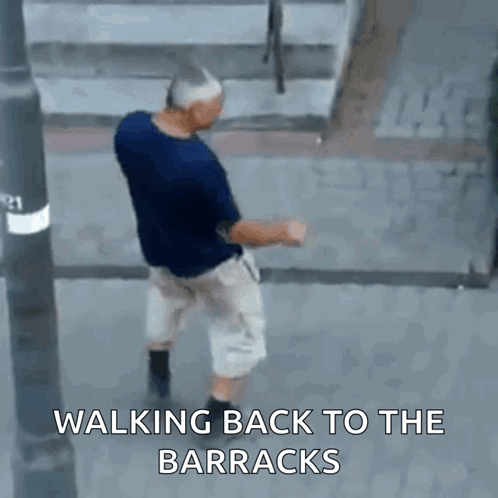Man Walking Back To Barracks On Street GIF